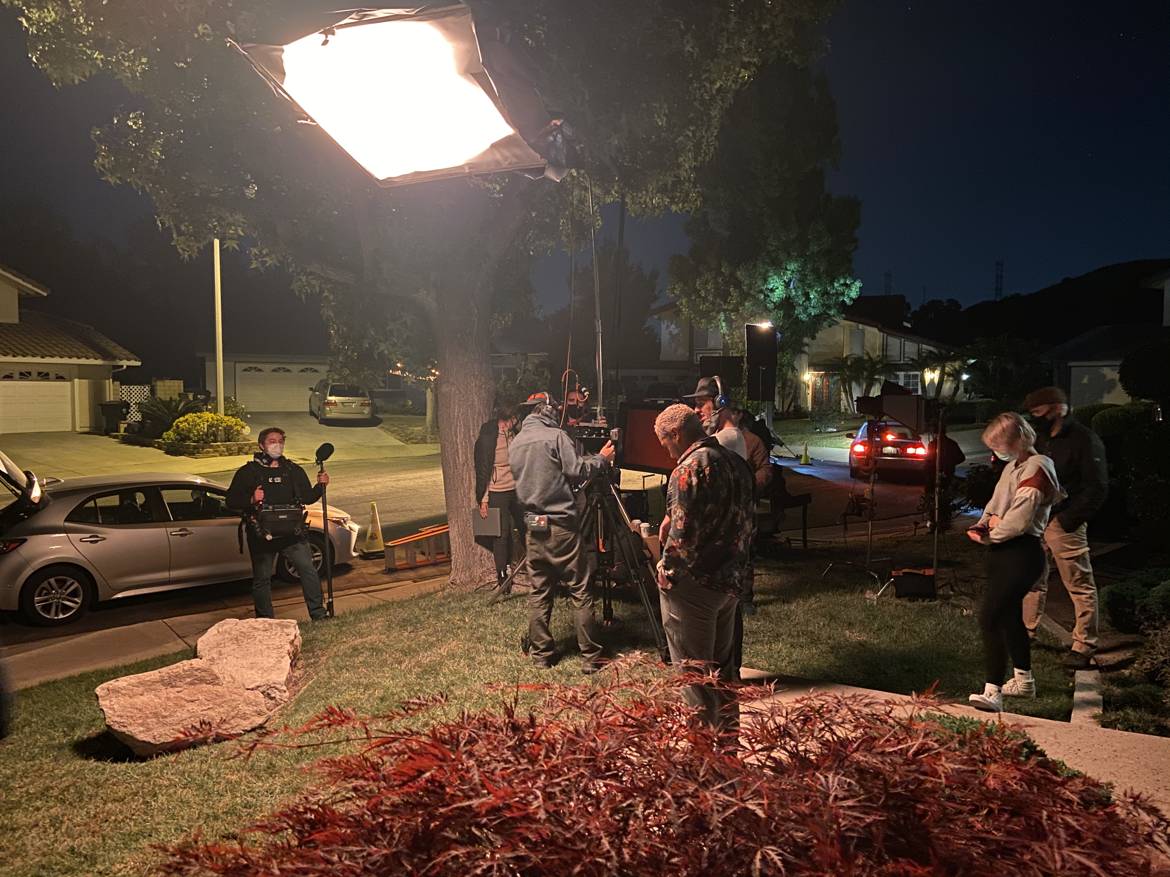 The Fallen Drive team prepares for a shot outside at night